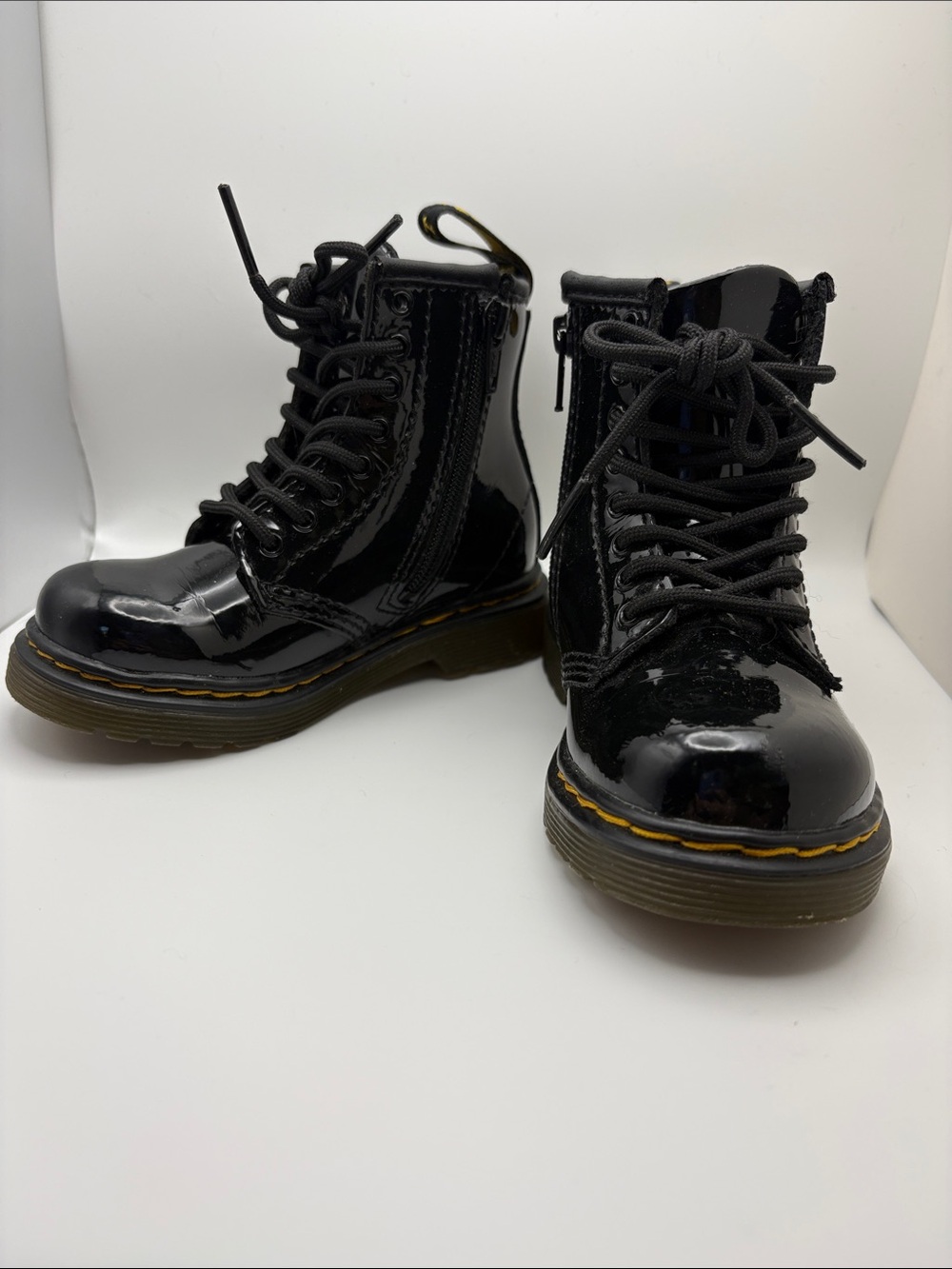 Dr. Martens Kids Glossy Black Patent Lace-Up Boots with Yellow Stitching